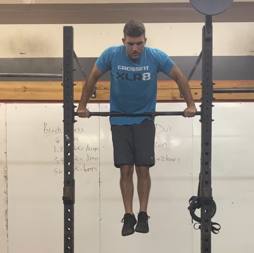 Man doing a muscle up showing improved performance